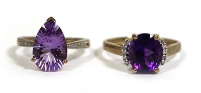 Lot 728 - Two 9ct yellow gold dress rings set purple and...