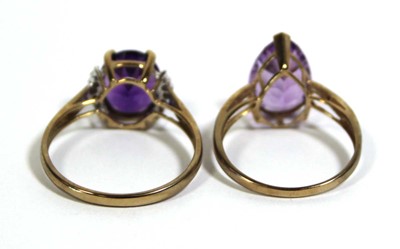 Lot 728 - Two 9ct yellow gold dress rings set purple and...