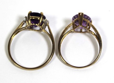 Lot 728 - Two 9ct yellow gold dress rings set purple and...