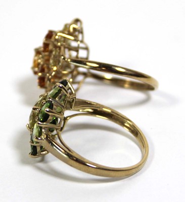 Lot 731 - Two 9ct yellow gold dress rings set green and...
