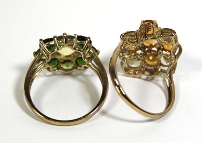 Lot 731 - Two 9ct yellow gold dress rings set green and...