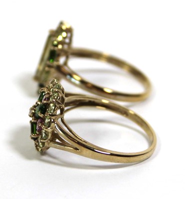 Lot 732 - Two 9ct yellow gold dress rings set green and...