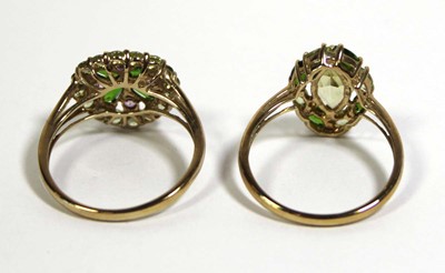 Lot 732 - Two 9ct yellow gold dress rings set green and...
