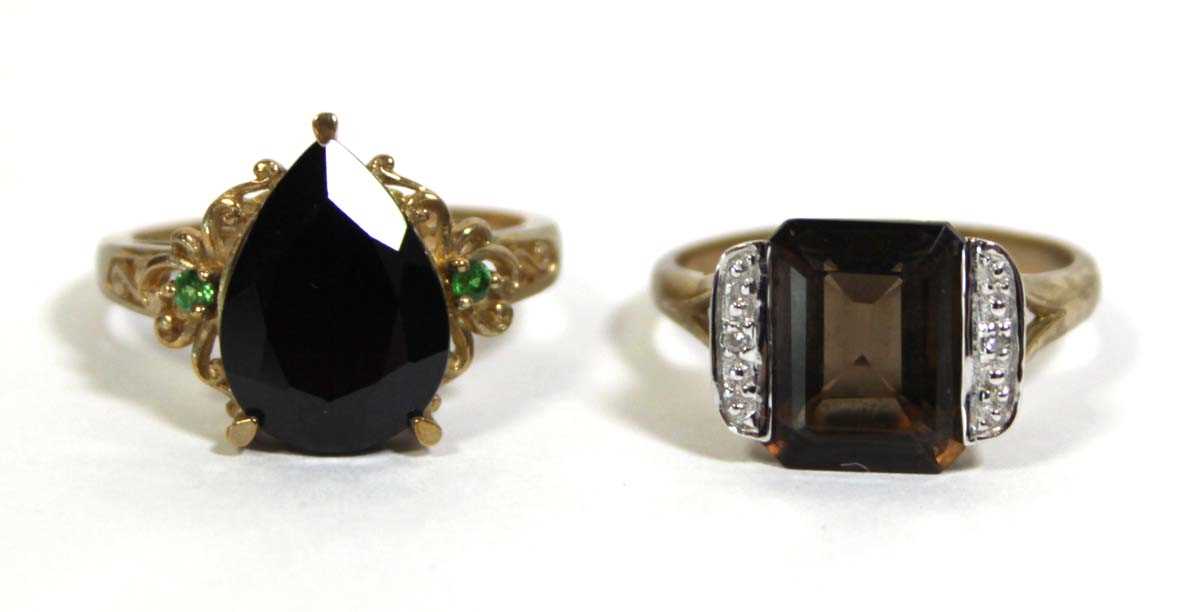 Lot 733 - Two 9ct yellow gold dress rings set green and...