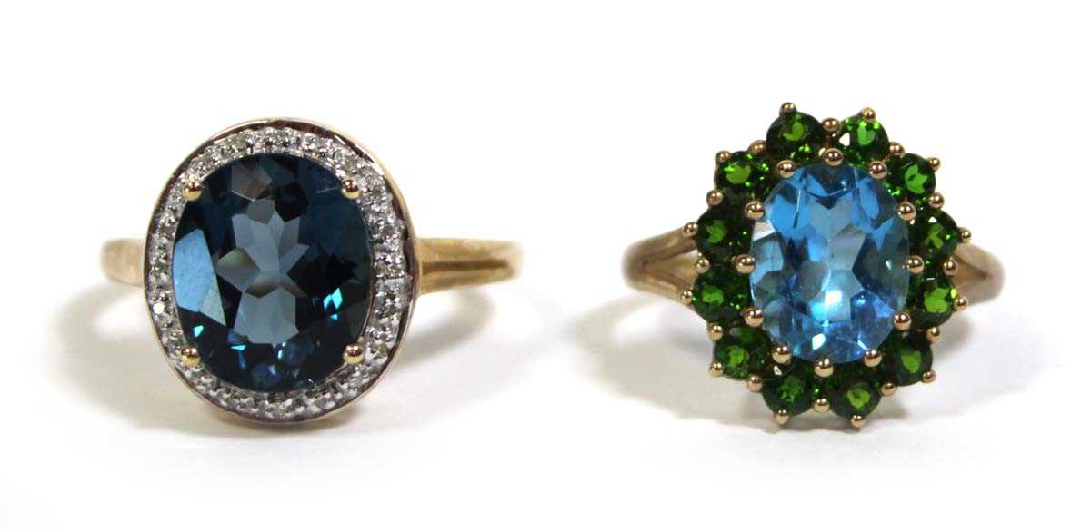 Lot 734 - Two 9ct yellow gold dress rings set green and...