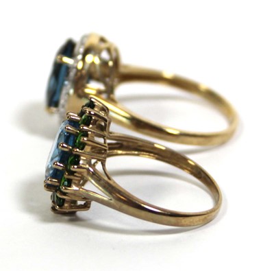 Lot 734 - Two 9ct yellow gold dress rings set green and...
