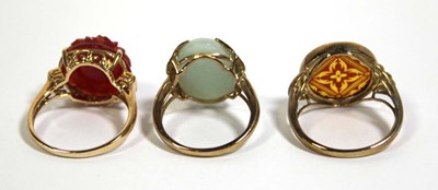 Lot 741 - Three 9ct yellow gold dress rings set pale...