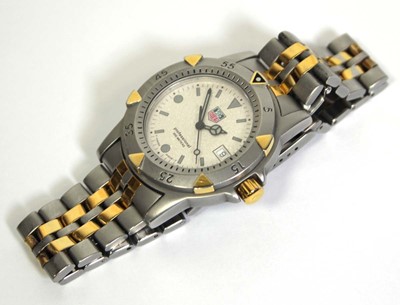 Lot 488 - A unisex stainless steel wristwatch by Tag...