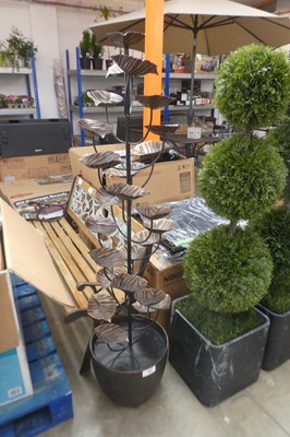 Lot 2011 - Black and bronze colour leaf trickling water...