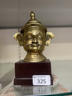 Lot 325 - An eastern style brass bust of a gentleman on...