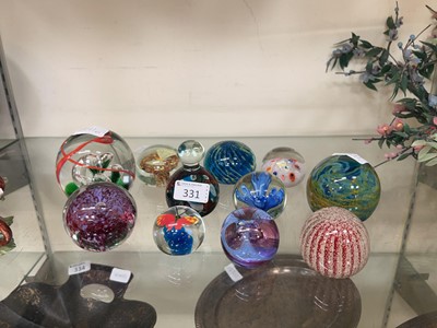 Lot 331 - Eleven glass paperweights by various makers to...