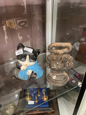 Lot 362 - Two cast metal door stops