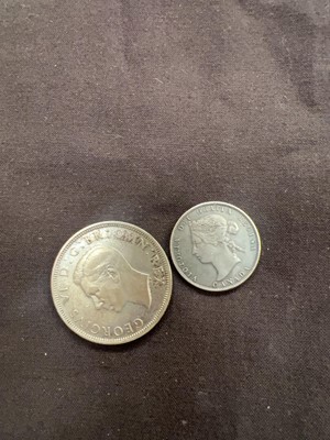 Lot 383 - A bag containing an 1893 25 cent coin and a...