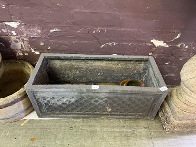 Lot 17 - A retangular planter containing a collection...