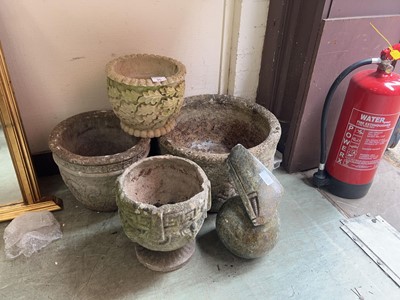 Lot 35 - Four composite stone garden planters along...