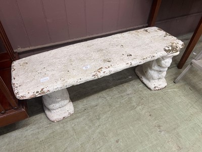 Lot 51 - A white painted composite stone garden bench...