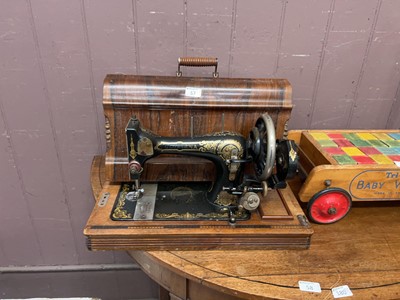 Lot 57 - A cased Gloriana manual sewing machine