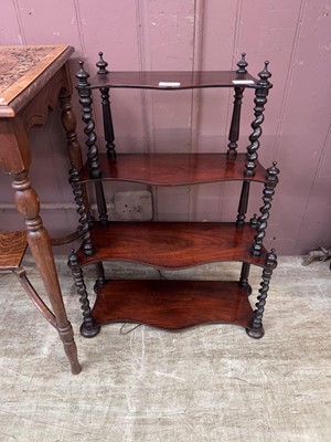 Lot 65 - A mahogany four tier wall mounted shelving unit