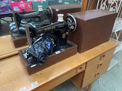 Lot 104 - A cased Singer manual sewing machine