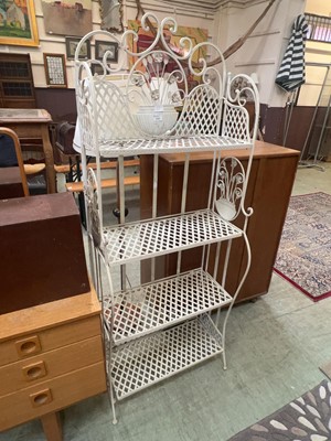 Lot 105 - A white painted metalwork four tier folding...