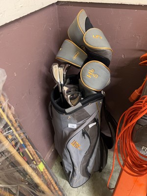 Lot 136 - A golf bag containing a set of Wilson 'Ultra...