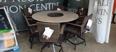 Lot 2020 - A circular composite topped outdoor garden...