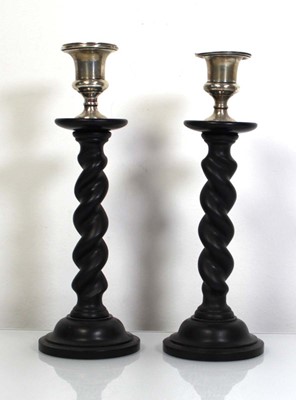 Lot 302 - A pair of barley twist candlesticks, each with...