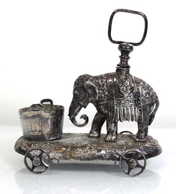 Lot 304 - A cast metal cruet stand modelled as an...