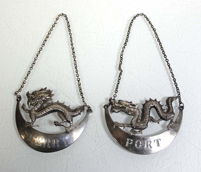 Lot 310 - A near pair of Chinese Export silver decanter...