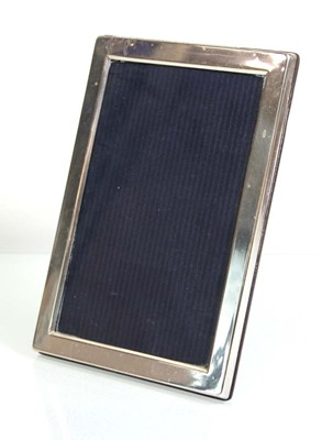 Lot 311 - A modern silver easel back photograph frame of...