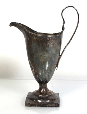 Lot 331 - A George III silver cream jug of helmet form,...