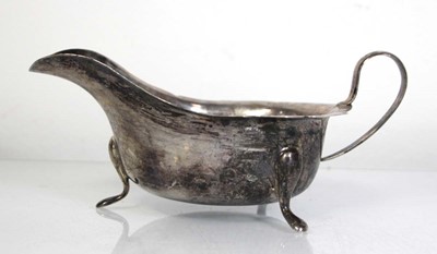 Lot 335 - A silver sauce boat of typical form, Viners,...