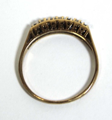 Lot 746 - A 9ct yellow gold 'Forever' ring set four...