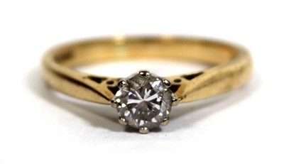 Lot 747 - An 18ct yellow gold ring set brilliant cut...