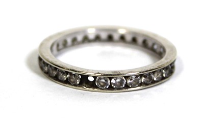 Lot 748 - A 9ct white gold eternity ring set cubic...