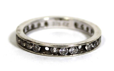 Lot 748 - A 9ct white gold eternity ring set cubic...