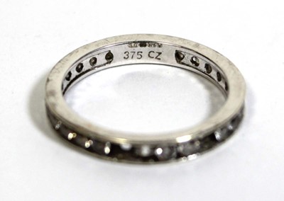 Lot 748 - A 9ct white gold eternity ring set cubic...
