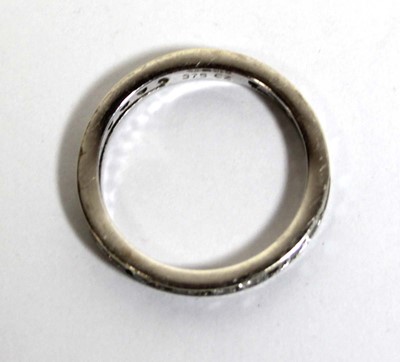 Lot 748 - A 9ct white gold eternity ring set cubic...