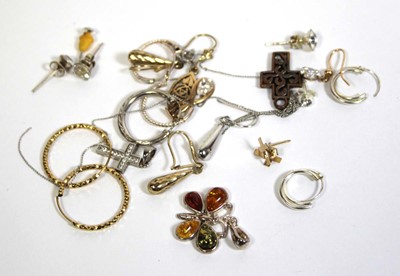 Lot 750 - A 9ct white gold cross pendant set cubic...