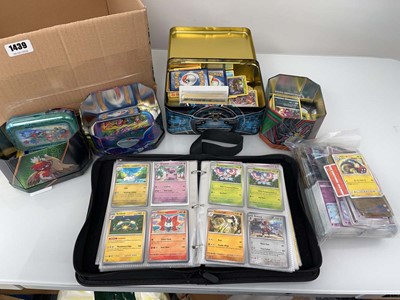 Lot 1439 - Quantity of tins of loose Pokémon cards and a...