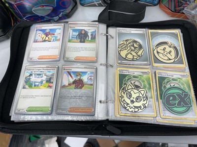 Lot 1439 - Quantity of tins of loose Pokémon cards and a...