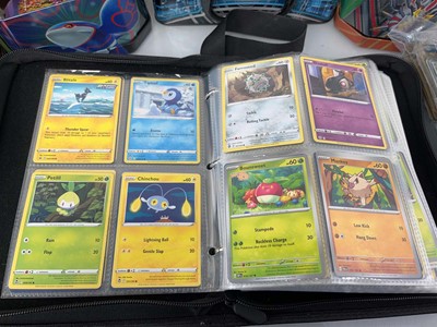 Lot 1439 - Quantity of tins of loose Pokémon cards and a...