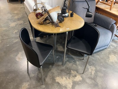 Lot 1023 - 4 seater dining table on chrome supports in a...