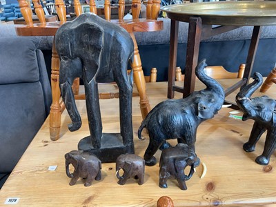 Lot 1027 - An assortment of carved wooden elephants and...