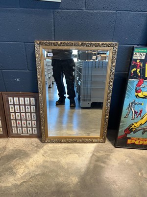 Lot 1075 - Gilt framed and beveled rectangular wall mirror