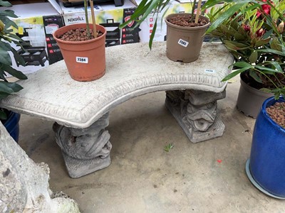 Lot 2630 - Decorative curved top concrete bench on koi feet