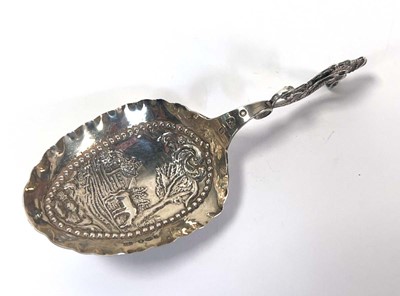 Lot 352 - A Dutch silver caddy spoon, typically repousse...