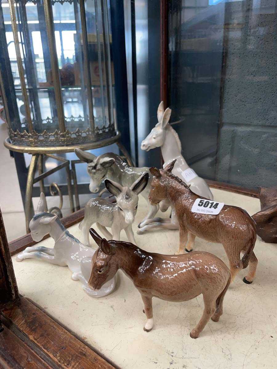 Lot 5014 - Seven Beswick, Lladro and unbranded donkey...