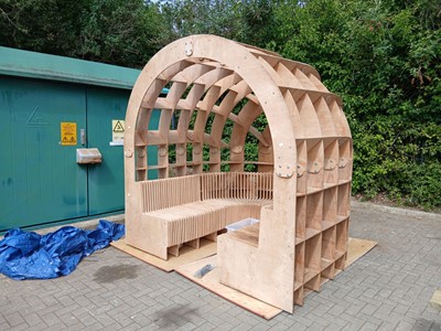 Lot 4473 - Sectional plywood hut frame with seating