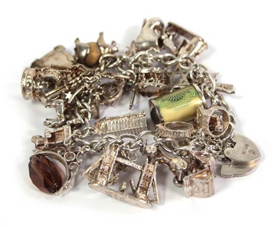 Lot 753 - A silver curblink bracelet with padlock clasp...